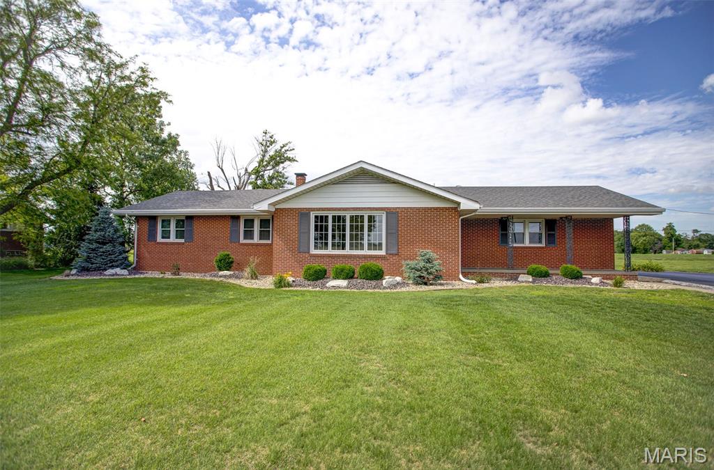Beautifully remodeled 3 bedroom, 2 bath all-brick home situated on a large lot just on the outskirts of town! This move-in ready home offers updated finishes throughout, spacious living areas, and a full basement providing plenty of storage or additional living potential. Step outside to enjoy the private deck overlooking the backyard — perfect for relaxing or entertaining. This property offers the best of both worlds with an attached 2 car garage plus an oversized detached 1 car garage with extra room for storage, hobbies, or workspace. Enjoy the peaceful setting with the convenience of town just minutes away! This one won't last long!