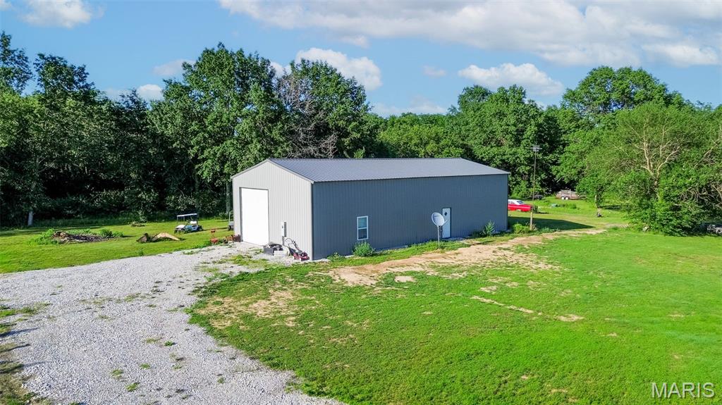 Looking for a place to build your dream home with room to roam? This 2.79 acre lot is waiting. The property features a 30'5" x 59' 10" Polebarn with concrete floors, oversized garage door, 288 sq ft finished into a bath & kitchen/sitting area, water heater, and electric is at property. New owners will have to tap on to water and install a septic system. "SOLD AS IS".