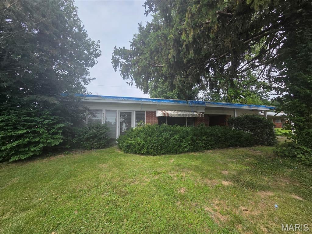 Great Opportunity for a retro rehab project. Over 1400 sq. ft. of great space. All Brick ranch on almost 1/2 acre corner lot . Has 1 car attached garage and over sized 1 car carport on huge corner lot. Home currently has 2 bedrooms and 1 and 1/2 baths but could easily be expanded. Will need completely rehabbed to make it work. Market analysis is $150,000 to $160,000.  Must sign hold harmless waiver prior to viewing property due to roof leak. This is a full rehab . Sellers are aware that roof has leaked and caused damage to ceilings. They are selling as is and is PRICED ACCORDINGLY . Will not get any utilities connected for inspections or provide for any inspections. Strictly sold as it is. Sellers require 72 hours to respond to any offer. This is a great opportunity for all brick ranch house rehab to have great equity in a home.