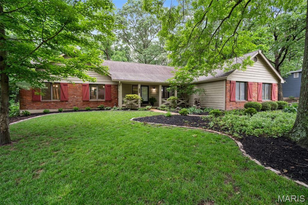 Serenity surrounds this beautiful, wooded, better than half acre lot. The views from the expansive windows in the recently enclosed sunroom are spectacular. Nature at its best. The home has been updated throughout offering comfort and ease of living.  Enter into the home with the dining room immediately to your right, and foyer opening to the vaulted great room with skylights, gas fireplace and bar area which opens to the light filled sunroom with heated flooring, and recently updated kitchen. The kitchen with eat-in counter and breakfast room with bay windows overlooking the wooded rear yard, has been updated with 42" white cabinets, granite counter surfaces and all new stainless appliances. Adjacent is the main level laundry and access to the attached two car garage. The main floor primary suite has a lovely updated bath with walk-in shower and walk-in closet. The main floor includes two additional nice sized bedrooms with walk-in closets, plus a hall bath. The expansive lower level is home to a fourth bedroom, full bath, office area and large recreation room that walks out to a patio overlooking the wooded yard. Some additional features; new driveway, new garage door, home sits on a quiet cul-de-sac, join the community pool for $315/year. Learn more about the neighborhood @ https://windingtrailshoa.org