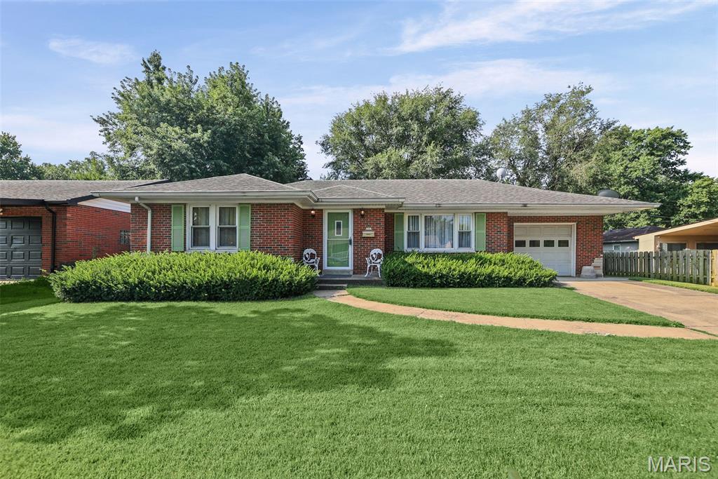 STUNNING FULL BRICK BEAUTY IN DESIREABLE AREA. CLOSE TO SHOPPING AND RESTAURANTS. LIGHT AND BRIGHT LIVING ROOM HAS AWESOME PICTURE WINDOW WITH NEW DRAPERY. ALL LIVING ROOM FURNITURE CAN STAY. ELECTRIC FIREPLACE MAY BE PURCHASED SEPARATELY. AMAZING OPEN KITCHEN WITH LOADS OF WHITE CABINETS AND PLENTY OF COUNTER SPACE. WHITE SUBWAY TILE BACKSPLASH. FULLY EQUIPPED WITH B/I OVEN & ELECTRIC SMOOTH SURFACE COOKTOP. DISHWASHER, MICROWAVE AND FRIDGE INCLUDED. CONVENIENT BUILT-IN MATCHING DESK. DINING ROOM OPENS TO KITCHEN AND IS FILLED WITH LIGHT. PERFECT FOR LARGE FAMILY GATHERINGS. HUGE PRIMARY BEDROOM HAS DOUBLE CLOSETS. FURNITURE CAN STAY. COMFORTER & CURTAINS WILL NOT. PRIVATE GUEST BEDROOM HAS FULL SIZE BED THAT WILL STAY, AS WELL AS BEDDING & CURTAINS. MAIN FLOOR STACK WASHER/DRYER WILL REMAIN. VERY TASTEFULLY RENOVATED FULL BATH HAS GLASS TILE TUB SURROUND, NEW VANITY, TOILET & LIGHTING. ALSO FEATURES BEADBOARD WAINSCOTING. MASSIVE OPEN, DRY BASEMENT HAS BEEN FRESHLY PAINTED & READY FOR YOUR PERSONAL TOUCHES. NEWER PLUMBING. BACK YARD IS FULLY FENCED & HAS GIANT PRIVACY SHRUBS ALONG THE BACK. COVERED PATIO PERFECT FOR BBQ-ING. 1 CAR ATTACHED GARAGE. NEW ANDERSON STORM DOORS. THERMAL TILT-IN WINDOWS. ALL FURNITURE INCLUDED. JUST PACK YOUR BAGS!! AMERICAS PREFERRED HOME WARRANTY PROVIDED FOR $650. HOME HAS PASSED CITY FOR OCCUPANCY.