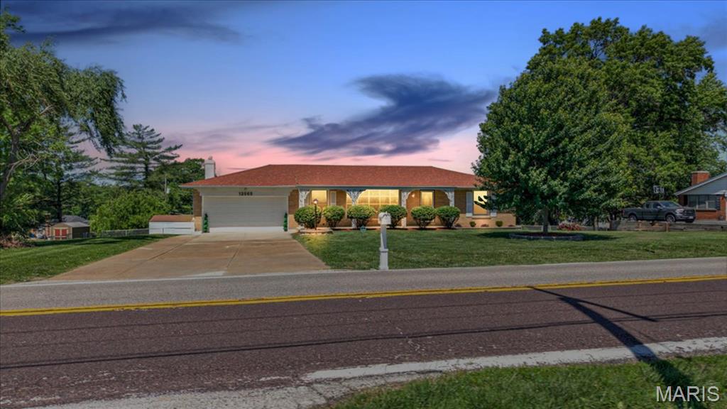 Welcome to 12565 Old Jamestown Road — a beautifully renovated ranch-style home that perfectly blends modern updates with comfortable, everyday living.

This stunning home features 3 spacious bedrooms and 2 full bathrooms on the main level, designed with both functionality and style in mind. The inviting living room flows seamlessly into a bright dining area that overlooks the updated kitchen, creating the perfect space for gatherings and entertaining. Natural light pours in through the charming enclosed sun porch, adding warmth and character throughout the home.

The finished walkout basement expands your living space even further, offering a large family area ideal for movie nights, game days, or relaxing. You'll also find a versatile bonus room—perfect for a home office, guest space, or gym—along with an additional full bathroom for added convenience.

Situated on a generous half-acre lot, this property provides plenty of outdoor space to entertain, garden, or simply enjoy peaceful surroundings. The two-car garage adds practicality, while the expansive yard offers endless possibilities for hosting family and friends.

This move-in ready home truly has it all—space, style, and comfort—inside and out. Schedule your showing today and come experience everything this incredible property has to offer!

Occupancy is completed and ready to move into!
