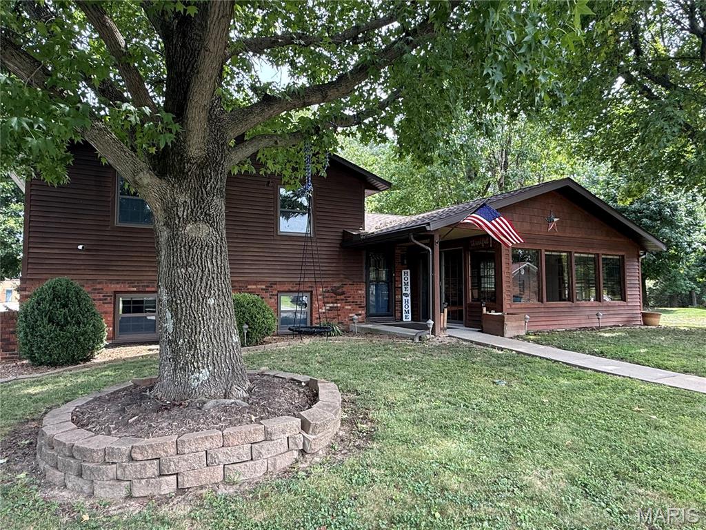 This inviting 3-bedroom, 2-bath home combines comfortable living spaces, thoughtful updates, and an expansive setting in a convenient Steeleville location. Situated on approximately three-quarters of an acre directly behind Steeleville Grade School, the property offers plenty of room to enjoy both indoor and outdoor living.
Property Description

Welcome home to this well-maintained 3-bedroom, 2-bath residence featuring a spacious open-concept main floor. The kitchen offers abundant cabinetry, generous counter space, stainless-steel appliances, and a convenient breakfast bar that opens to the dining and living areas, Creating an ideal layout for everyday living and entertaining.