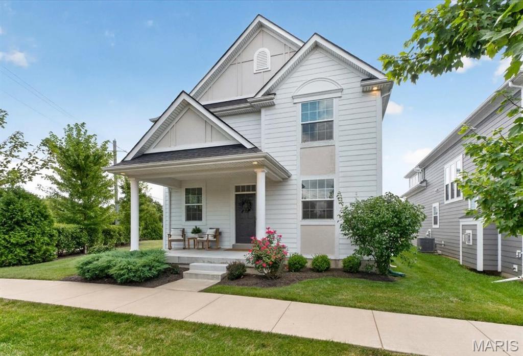 This gorgeous, nearly-new home has every upgrade imaginable and is truly ready for its next owner. This spacious 4-bedroom, 3.5-bath two-story offers the perfect blend of style, comfort, and location — just minutes from everything, with the added bonus of a short stroll to Wildwood Town Center's restaurants, shops, farmers market, trails, and green space.

Craftsman-style curb appeal greets you from the moment you arrive, with a welcoming covered front porch and beautifully maintained landscaping setting the tone for what's inside. Step through the door into an open floor plan built for both everyday living and effortless entertaining. High ceilings, rich luxury vinyl plank flooring, a tasteful color palette, and abundant recessed lighting flow throughout the main level. A separate dining room with privacy windows adds extra light and elegance, while the living room centers around a cozy gas fireplace — the perfect spot to unwind.

At the heart of the home is a true chef's dream kitchen, featuring crisp white custom cabinetry, a farmhouse sink, upgraded stainless steel appliances, quartz countertops, and a full pantry. The adjoining breakfast room impresses with a custom bar, wine fridge, and overflow cabinetry — ideal for hosting family and friends. A convenient powder room and attached 2-car garage complete the main level.

Upstairs, a versatile bonus loft and dedicated laundry room add everyday functionality. Two spacious bedrooms share a full bath, while the sunken primary suite serves as a true owner's retreat. This generously sized sanctuary includes a comfortable sitting area, a spa-like en-suite bath with a double vanity and shower, and an expansive walk-in closet with thoughtful storage and organization.

The finished lower level offers a deep pour for extra ceiling height and includes a large recreation room perfect for movie nights, game days, or hosting guests. A 4th bedroom with egress window and full bath make this level ideal for visitors. Ample additional storage rounds out this level.

Step outside to a rear patio and large side yard, all situated on a corner lot with plenty of room to build the outdoor living space of your dreams. 

Beyond the home itself, the location can't be beat. Nestled in the sought-after Main Street Crossing community near Wildwood Town Center, you'll enjoy a walkable lifestyle with easy access to local restaurants, shopping, parks, and community amenities — all while maintaining a peaceful, quieter residential setting. Nearby outdoor spaces include scenic walking trails and parks, offering the perfect balance of convenience and nature.
