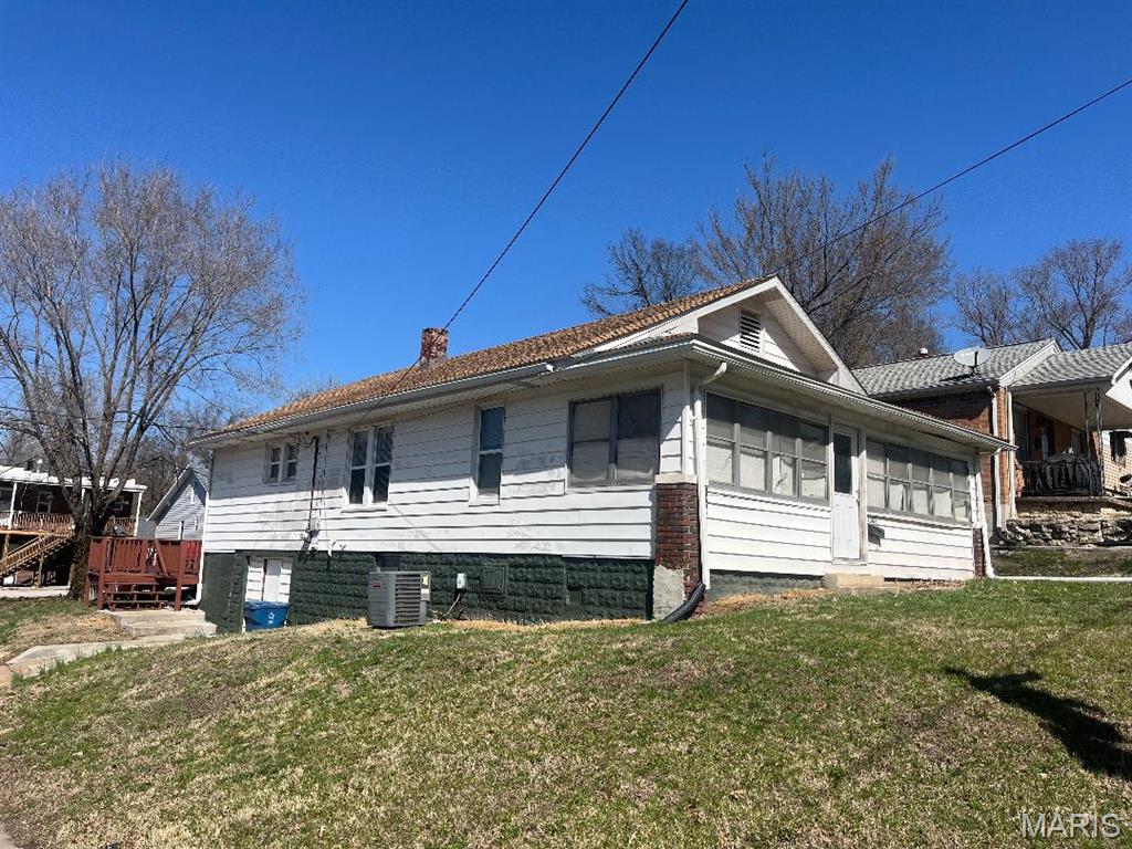 This spacious home sits on a corner lot and features 3 bedrooms, walk-up attic, full walk-out basement, enclosed front porch, newer windows, Furnace & A/C new in 2024, roof ~ 5 yrs. old, new flooring in living room, new wiring, hardwood floors.  This home is in MOVE-IN condition and includes a gas stove, refrigerator, dishwasher, washer & dryer.