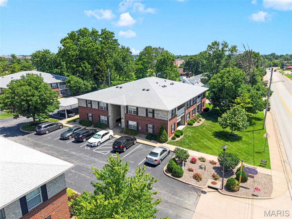 Welcome to this beautifully maintained 2 bed, 2 bath condo with assigned covered parking in the desirable Westbury Place community! Enter into the large open living room & notice the open concept floor plan! Generously sized kitchen features all stainless steel newer (2020/21) appliances that have barely been used! Breakfast room & eat in kitchen is the perfect spot to start your day. Head out to the private covered balcony to enjoy your morning coffee. This condo features a divided bedroom floor plan that will suit your needs perfectly! Primary bedroom includes a generously sized walk-in closet and an en-suite bath. The second bedroom offers private access to the hall bath. Great space for visiting guests or a work from home office. Large in-unit laundry room with washer & dryer for ease & convenience. The grounds offer sidewalks for walking & picturesque landscaping. Situated just off Highway 70, this exceptional property is located in the heart of St. Peters w/ easy access to dining, retail & more. The covered parking spot, which is included with the purchase of the condo, is right outside the building, space 124. This meticulously maintained beauty has been recently updated with new HVAC and water heater (2022), toilets (2020), landscaping (2021), and paint (2021)! There are not many condos that are this clean, have assigned covered parking with updated systems - but are a blank slate, ready to make your own home sweet home! Don't miss this opportunity. Schedule a showing to see for yourself why 124 is a hidden gem!