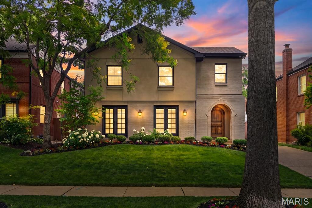 Come experience Clayton luxury living at its finest, with over 5,000 square feet of living space, and a potential 5-bedroom, 4.5-bath floorplan across three finished levels.  Conveniently located just one block from downtown's renowned restaurant row, your lifestyle will never be the same.  The spectacular chef's kitchen features Carrera marble countertops, including a massive island, 6 burner Wolf range/oven with hooded vent, Sub-Zero refrigerator, copious amounts of custom cabinetry, organized walk-in pantry, and mudroom with sink and built in shelves.  The kitchen area opens to the expansive hearth room, perfect for everyday life as well as entertaining. This exceptional space includes a full wet bar with ice maker, wine and beverage refrigerators, and features a wood-burning stone fireplace, and scenic glass doors that lead to the private patio with an automated retractable 20' x 20' awning and state-of-the-art sport court in the backyard.  The welcoming entry invites you to the living room boasting beautiful French doors, a decorative fireplace with mantle, and nice flow into the dining room.  Upstairs, the primary suite feels like a private retreat.  Set away from the other bedrooms, it has vaulted ceilings, an oversized custom built dressing room to die for, and sumptuous spa-inspired bath with dual vanities, deep soaking tub, dual-head walk in shower, private water closet, vaulted ceilings, and skylights. Three additional bedrooms are serviced by two lovely updated baths, one an en suite and the other a hallway with dual-vanity sinks and soaker tub.  The second-floor laundry room is complete with a sink, two large capacity stackable laundry units, and a third mini washer.  The finished lower level adds approximately 1,500 square feet of wonderfully finished space including an expansive family room and recreation area with 9-foot ceilings, its own wet bar with beverage refrigerator and ice maker, and a beautifully finished 4th full bath.  Additional exterior highlights include a large two-car garage, aggregate driveway, and covered front and rear entries. Interior features include plantation shutters, rich hardwood floors, central vacuum, and a Crestron Home smart system for seamless control of the property's systems (surround speakers, security system, lighting, heating and cooling, door locks) from a pad or smartphone.  The property also has a dual sump pump system with battery backup, and an irrigation system to manage the lush lawn and flower beds.  Make you appointment soon, you don't want to miss the opportunity to acquire this stunning property in one of the best locations in Clayton.