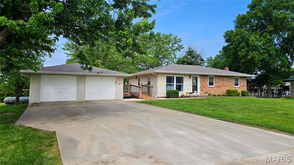 Main level offers a 3-bedroom, 2-bath walk-out finished basement home located just outside the city limits of Fulton, MO. With 2,261 finished square feet of thoughtfully designed living space, this home provides a great blend of style, functionality, and privacy. The kitchen features quartz countertops and ample cabinet space. Hardwood flooring runs through the dining and living room, while the bedrooms include new carpet. The main level bathroom has been recently remodeled. Exterior features include a large deck ideal for relaxing evenings and a spacious yard. A 24x24 detached 2-car garage provides additional storage and workspace. Conveniently located with quick access to Highway 54 while offering a quiet, country setting.