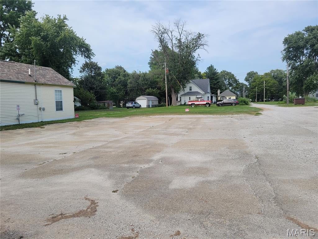 Prime Commercial Lot Ready for Your Next Business Venture!

This 55' x 140' vacant commercial lot offers an excellent opportunity to bring your business vision to life. The property extends from the main road all the way to the rear alley and features a spacious, level grassy area with plenty of potential for development.

Enjoy excellent visibility and exposure with an estimated daily IDOT traffic count of approximately 2,900 vehicles passing by the property. The versatile layout provides numerous possibilities, including a retail business, drive-through establishment, or a unique food truck destination with a covered outdoor seating area.

With its convenient access, high visibility, and flexible potential, this property is ready for your next business venture!

Buyer to verify availability of utilities, connection locations, and all applicable hookup and connection fees.