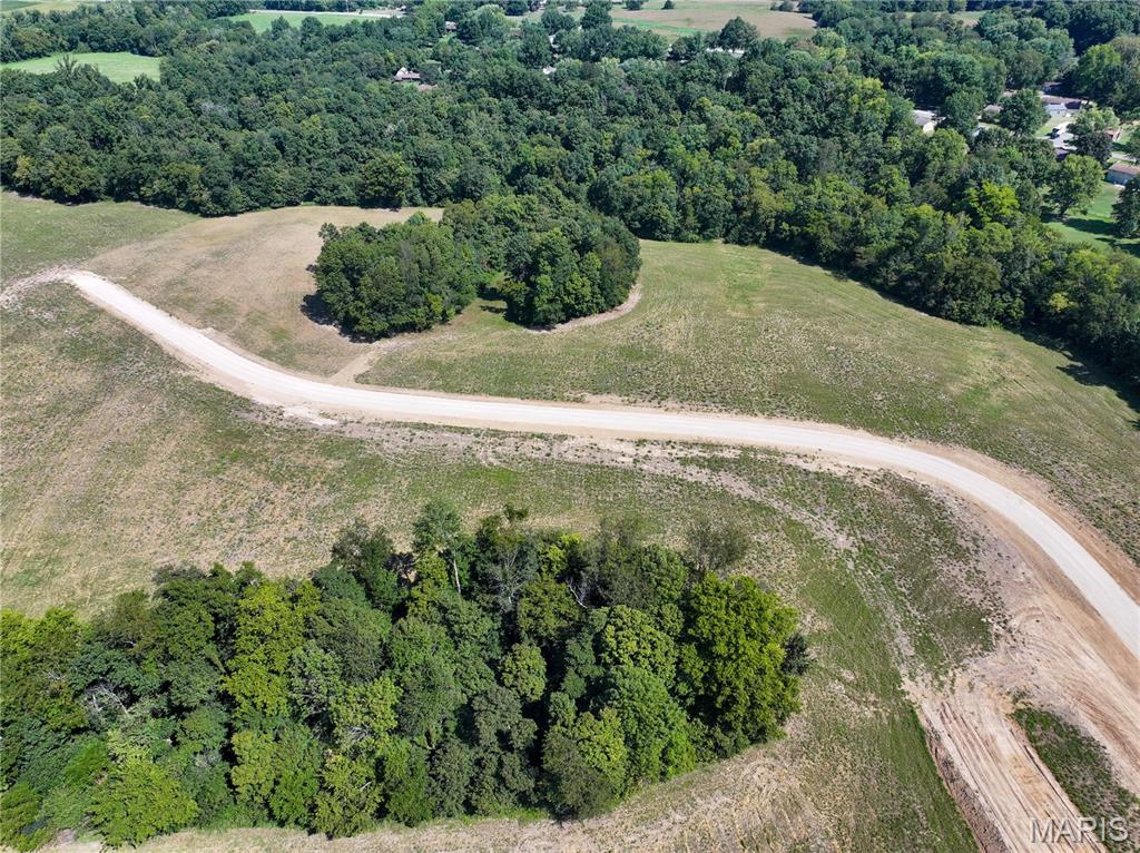 Build your country dream on this beautiful 10± acre tract in Kinder Farms Subdivision, located just outside Jackson, Missouri, off Highway 34. Featuring a great mix of open ground and mature timber, the property offers plenty of possibilities for your new home, shop, barn, pasture, or recreational space. Livestock, horses, and outbuildings are permitted, and electric and water are available. Bring your own builder and create the country property you've been looking for. Light restrictions will apply. Approximately 3 miles from Jackson Schools, this tract provides plenty of room to spread out while keeping you conveniently close to town.

A survey will be completed prior to closing to determine the exact acreage. Final purchase price will be based on the surveyed acreage and the agreed-upon price per acre.