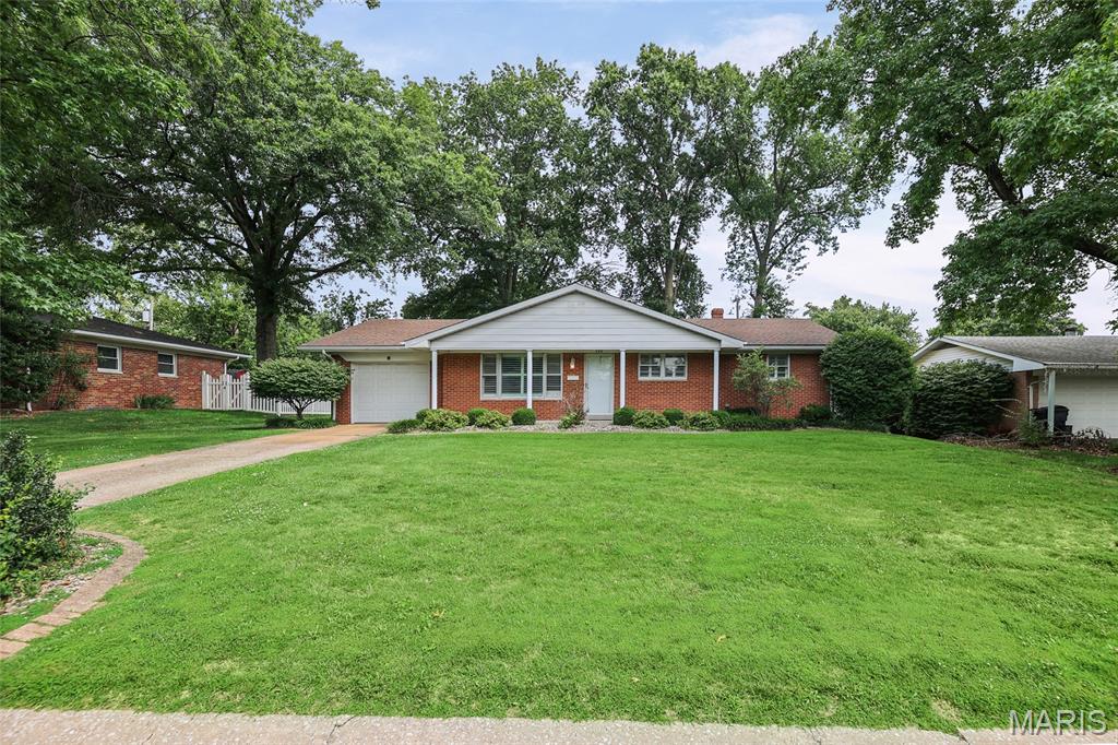 Lovingly cared for and meticulously maintained, this all-brick ranch is ready for its next owner! Offering a partially finished basement, one-car attached garage, and timeless charm throughout, this move-in ready home also provides the perfect opportunity to add your own personal updates and create your dream home. Step inside to a spacious living room featuring beautiful hardwood floors, crown molding, a large picture window that fills the space with natural light, and a convenient coat closet. Plantation shutters, installed in 2011, add classic style throughout much of the home. The formal dining room showcases attractive parquet wood flooring and is perfect for everyday meals or entertaining guests. The kitchen offers abundant cherry cabinetry, a breakfast bar, bay window, and a complete white appliance package including a gas range, dishwasher, microwave, and refrigerator. Three main-level bedrooms all feature hardwood flooring. The primary suite includes mirrored closet doors and a private bath with a walk-in shower, ceramic tile flooring, and medicine cabinet. Bedrooms two and three are generously sized with ample closet space. The lower level expands your living area with a spacious family room complete with a bar and beverage refrigerator, plus a versatile recreation room featuring built-in cabinetry and shelving. You'll also appreciate the abundance of unfinished storage space. An additional sink, stove, refrigerator, freezer, washer, and dryer all remain, providing exceptional convenience and easy hosting for family gatherings. Step outside to enjoy the beautifully designed brick paver patio with built-in seating, installed in 2015—an ideal space for relaxing or entertaining. The attached one-car garage includes a workbench, storage closet, and OH garage door opener replaced in 2013. For added peace of mind, Helitech professionally repaired the home's hairline foundation cracks using carbon fiber reinforcement, and the transferable warranty will be passed on to the new owner. A solid, well-maintained home with great bones, endless potential, and an unbeatable opportunity to make it your own!