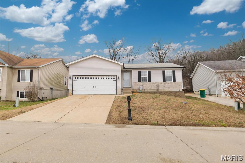 Welcome Home to this beautiful 3 bed 2 bath ranch home! Entryway brings you into a gorgeous open concept floor plan, ideal for gatherings. The great room offers wood laminate flooring and vaulted ceilings and lots of natural light. Beautifully finished kitchen offers custom cabinets and upgraded appliances including refrigerator. Primary bedroom suite is a generous size and offers a full bath and large walk-in closet. The lower level is a full basement and features an egress window and a rough in bath. The home is meticulously maintained and completely move-in ready. Enjoy the oversized back patio and large level backyard all perfect for entertaining.