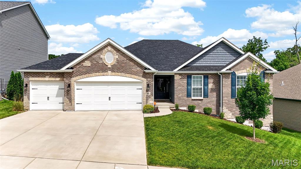 Why wait to build when this stunning 2022 ranch has it all? This 4 years young Augusta model Lombardo build with endless upgrades is offering 3 bedrooms, 3 bathrooms, and a spacious 3-car garage, this beauty backs to a peaceful pond, providing picturesque views right from your backyard. Step inside and immediately notice the elegant archways, 10-foot ceilings, luxury vinyl plank flooring, and wood-burning fireplace.

The gourmet kitchen is designed to impress with quartz countertops, staggered cabinetry, tile backsplash, double oven, electric cooktop, under and over-cabinet lighting, and a large center island perfect for gathering and entertaining. The custom walk-in pantry by STL Closet Company provides exceptional storage and organization.

The spacious primary suite features custom shades from Cardinal Blinds, a luxurious bath with an oversized walk-in shower, transom window, double adult-height vanity, private water closet, and a custom walk-in closet by STL Closet Company. Secondary bedrooms offer comfortable layouts, including a walk-in closet in one bedroom and plantation shutters throughout the guest bedrooms. The guest bath includes an adult-height vanity and toilet with a tub/shower combination.

Enjoy outdoor living on the composite deck installed in 2023 while taking in tranquil pond views. The exterior is already wired for your entertainment! Additional features include two coat closets, decorative carpeting on the staircase, Vivint security system, living room surround sound speakers, and an unfinished lower level with a 9-foot pour, bathroom rough-in, and three large windows ready for your finishing touches.

This move-in ready home combines modern design, quality upgrades, and a fantastic location—schedule your showing today!