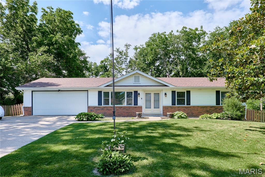 SHOWINGS START 9 AM 5/29/2026. DO NOT MISS THIS OPPORTUNITY TO OWN A SOLID THREE-BEDROOM RANCH SITTING ON OVER A HALF ACRE LOT IN A PRIME LOCATION AND WITH NO HOMEOWNER RESTRICTIONS! PRICED TO SELL AT THE PERFECT TIME TO ENJOY THIS HUGE POOL ALL SUMMER LONG! OWNER PREFERS TO DO NO REPAIRS IF ANY ARE NEEDED AND IS PREPARED FOR QUICK CLOSING. SOME TLC NEEDED, BUT BONES ARE GREAT! The main areas have laminate wood-look plank flooring and the three bedrooms have job finish oak flooring. Primary bedroom with en-suite. White kitchen cabinets and a stainless steel refrigerator (included) & microwave in the open kitchen lead to the dining/breakfast area. Sliding doors off the dining area lead to a full enclosed sunroom connecting to the large deck. Oversized 2-car garage offers lots of extra storage and also leads onto the deck. The lower level is partially finished and was in the process of being updated; it has lots of potential; the rough-in was previously a full bath. The lower level walks out to the backyard with extra shed-like storage under the sunroom. Close to everything, pretty curb appeal, and a beautiful, serene yard backing to the tree line. You don't want to miss this opportunity!