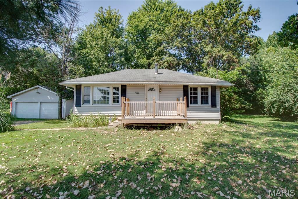 Welcome to this charming two-bedroom, one-bath home in Godfrey, situated on just under an acre! This property offers plenty of space, both inside and out, hardwood floors, a spacious eat-in kitchen with stove and refrigerator to stay, mudroom, and large bedrooms and closet space. The full, unfinished basement provides a sump pump for added piece of mind, abundant storage, and potential for future finishing. 

Outside, you’ll find a spacious two-car detached garage complete with a workbench, perfect for a workshop, hobbies, or additional storage. A brand-new A/C unit was installed in 2025. The roof is approximately 15 years old.

This home is being sold "as-is" but with nearly an acre of property, a detached garage, full basement, and several important updates, this Godfrey property offers a great opportunity for a buyer looking for space and potential!