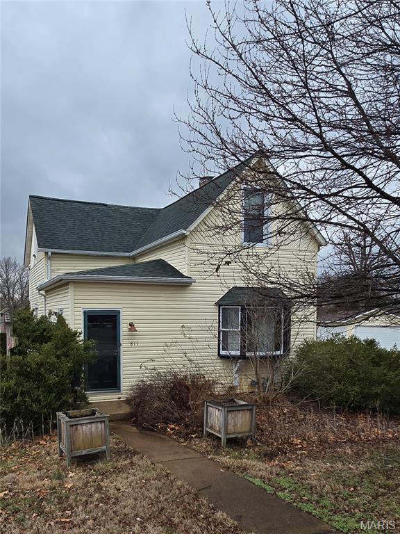 This three bedroom, two bath home with lots of character and charm sits on a third of an acre lot just off a cul-de-sac.  This home has been modernly updated with kitchen cabinets, lighting package, flooring and paint.  There is a large primary bedroom on the main level with extra closet space.  You will also find a full bathroom and laundry just off the kitchen.  The kitchen has beautiful cabinets, recessed lighting, extra storage and room for eat-in dining.  There is a separate dining room that can serve a multiple of purposes; inlcluding a sitting area, office, hobby or bonus room and a living room with a bay window.  Upstairs, your will find two more large bedrooms, a full bath and a reading nook of office area.  There is a basement for extra storage and two detached garages.  The single garage; closest to the home is perfect for gardening supplies and outdoor furniture.  The large, three bay garage at the rear of the property was often used for entertaining and a hobby area.  However, there is plenty of space for cars, boats and motorcycles.  Come check this out for yourself!  Call your favorite agent today!