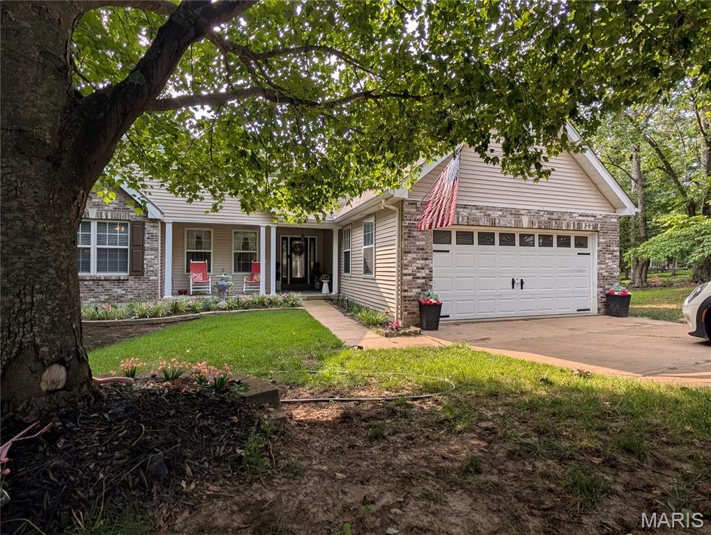 WOW O WOW  This ONE Owner, CUSTOM built Home will knock your socks off! (there's a great little main floor laundry where you can keep them clean)  The Spacious open floor plan flows seamlessly thru the bright & airy kitchen made for a cook!  There are TWO Fireplaces (The one on the main level has been converted to gas), a dining room with windows to take in the nature around you.   The 3 Bdrms on the main level include a master suite you will never want to leave, it has it's own sitting room, a private spacious bath, and a private door leading to the screened sunroom.  On the Lower Level, you won't want for anything!  The finished family room is where the 2nd fp is located and it walks out to more decking.  There is also another bedroom with its own full bath on the lower level & yet another room that could also be a Bdrm/Office/ or rec room!  There ARE Still 2 more rooms, one is a tucked away workshop & the other a large storage room with built in shelving.   The outside boast a Gazebo, Waterfall and extra parking (more than enough for an RV/ There is an electric hookup there) on the SECOND lot that adjoins. You'll have leaf filter gutter guards for ease of maintenance.  If all this isn't enough, you have all the amenities of Raintree - GOLF-BOATING-SWIMMING-FISHING-TENNIS-POOL-BEACH, EVEN a small campground.  This meticulously maintained home is truly where you want to Live!  Showings start Sat the 8th -make you appointment TODAY!