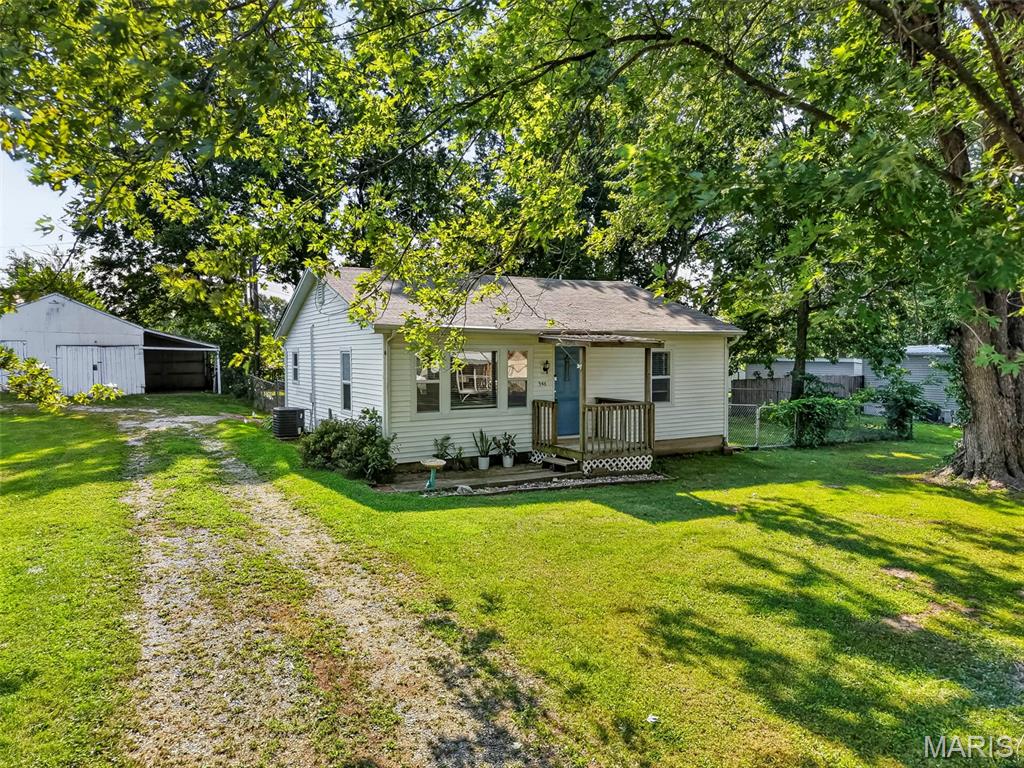 Charming 2-bedroom, 1-bath bungalow situated on nearly half an acre in the heart of Hawk Point! This move-in ready home features a new roof, luxury vinyl plank flooring throughout, and a spacious great room filled with natural light from beautiful windows. The gorgeous kitchen offers stainless steel appliances, abundant cabinetry, and plenty of counter space.

Both bedrooms are generously sized and feature walk-in closets, with a full hall bath conveniently located nearby. A spacious laundry room provides additional functionality and storage.

Outside, enjoy the huge, level yard with plenty of room to relax, entertain, garden, or play. The yard is partially fenced—perfect for pets! An oversized outbuilding/barn includes a 1-car garage plus an attached carport, offering ample parking, storage, or workshop space.

Small-town charm, modern updates, and room to spread out—all in a convenient Hawk Point location!
