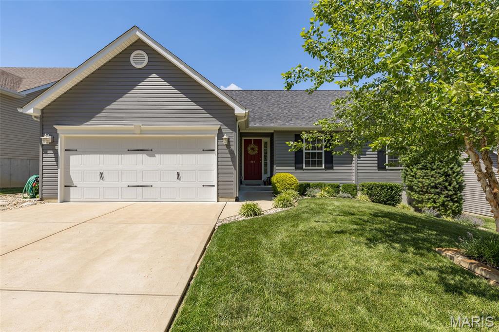 This newer home is super clean and ready for you to move in today.  Walk through the front door to an entry foyer that leads to a generously sized great room with a beautiful fireplace as the focal point.  To the left you will find a breakfast room, breakfast bar, and a kitchen with newer appliances, hard surface counters, 42" cabinets, and soft close drawers.  To the right you will find the bedrooms and bathrooms.  Carpet in all the bedrooms and engineered wood floors throughout the rest of the home.  There is a 12x12 deck with a retractable awning off the breakfast room, and a 10x8 patio off the basement.  Lots of storage space throughout the home.  The roof (architectural shingles) and siding are only a year old.  The basement is unfinished but waiting for your personal touch to finish with a rough in for a Bath, 2 Egress Windows, and French Doors leading to the patio.  There is also a convenient utility sink downstairs.  The picturesque professional landscaping along with the common ground across the street and behind the house gives the home a private, country feel but offers quick access to restaurants and shopping in Arnold and Fenton.  Safety features include sidewalks, streetlights, and only one entrance/exit to the subdivision, with the street ending in a cul-de-sac.  Enjoy the subdivision pool and clubhouse in the summer!!