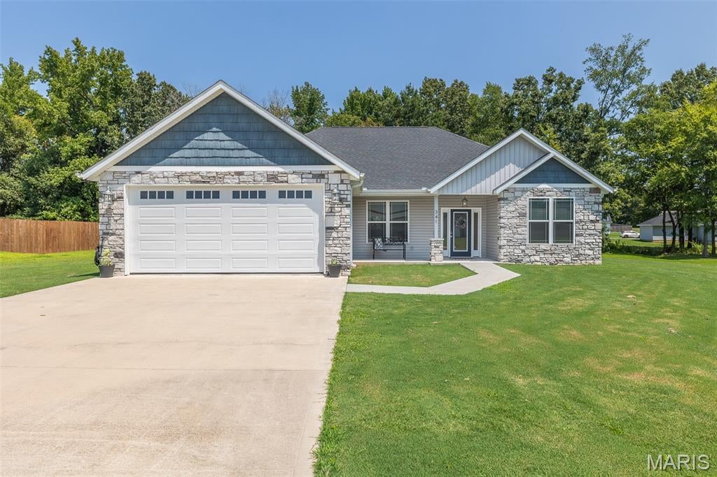 This gorgeous 3 bedroom 2 bath is a newer construction, built in 2022. Located in desirable Legacy Estates subdivision on a cul-de-sac. The stonework on the front of the house gives a stately appeal.  It has an open spacious living room, kitchen & dining room. The luxurious kitchen has clean white cabinets, stainless appliances, built-in microwave, and granite countertops with a large island. The laundry room also doubles a pantry. The beautiful hardwood floors run throughout the house. The large primary suite has a walk-in closet with built-in shelving, as well as an extremely nice bath room with dual sink vanity, walk-in shower and private toilet.  The partially covered rear patio, with a hot tub, overlooking a large back yard, will be a wonderful spot to spend your evenings. This one is a must see!