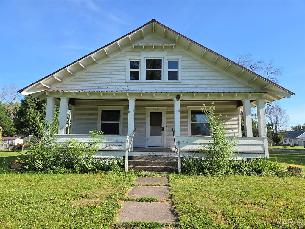 Here's an opportunity! Great corner-lot-location in Lewistown, this 2-bed, 1-bath bungalow offers additional living space upstairs, a full basement, covered front porch & garage.  Step inside the front door and you'll appreciate the oversized living room, leading right to the sunny dining room, and then a spacious kitchen. Both bedrooms are good sized, with a bathroom in between. Just off the kitchen is a handy mudroom/laundry room leading to the basement.  Upstairs you'll find a full room nearly finished and additional space nearly finished that could considerably add to the living space. Downstairs you'll find plenty of storage space and the utility area. There is a metal roof on the house & garage, double pane windows throughout, electric & plumbing have both been updated and there is plenty of potential to make this one your own!  A few cosmetic updates would drastically change the value here.

Utility providers include Ameren Electric, Liberty Gas, City of Lewistown water/sewer/trash and both Mark Twain & Rise are available for internet.

Homes in this price range don't come along often and usually don't last long!