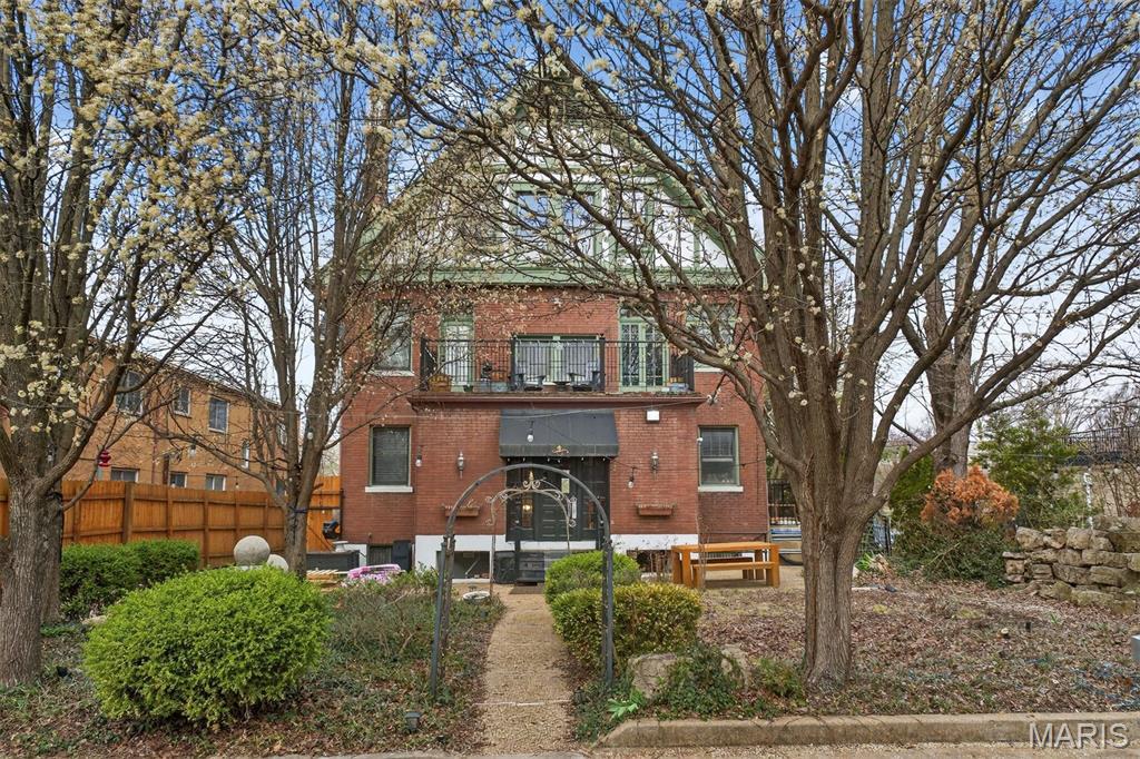 Thoughtfully repositioned, the $100,000 price improvement offers room to personalize and opportunity to prosper! 

Perfectly positioned on one of the city’s largest private lots, overlooking the historic Compton Hill Reservoir, this three-story residence offers rare seclusion with the best of St. Louis just moments away. The main level showcases gleaming restored hardwood floors, elegant crown molding, and two stately fireplaces that set a distinguished tone upon entry. Nearly every room retains its original pocket doors, beautifully preserved for timeless character.
Of the eight bedrooms, six are spacious suites with updated, oversized baths. A massive second-floor laundry and additional mudroom ensure effortless convenience. The handcrafted staircase leads to a fully reimagined third floor, featuring three bedrooms, two baths, and a full eat-in kitchen—an ideal private apartment or short-term rental opportunity.

With newer systems, newer windows, and extensive updates throughout, this remarkable home blends historic charm with modern versatility, offering endless possibilities.