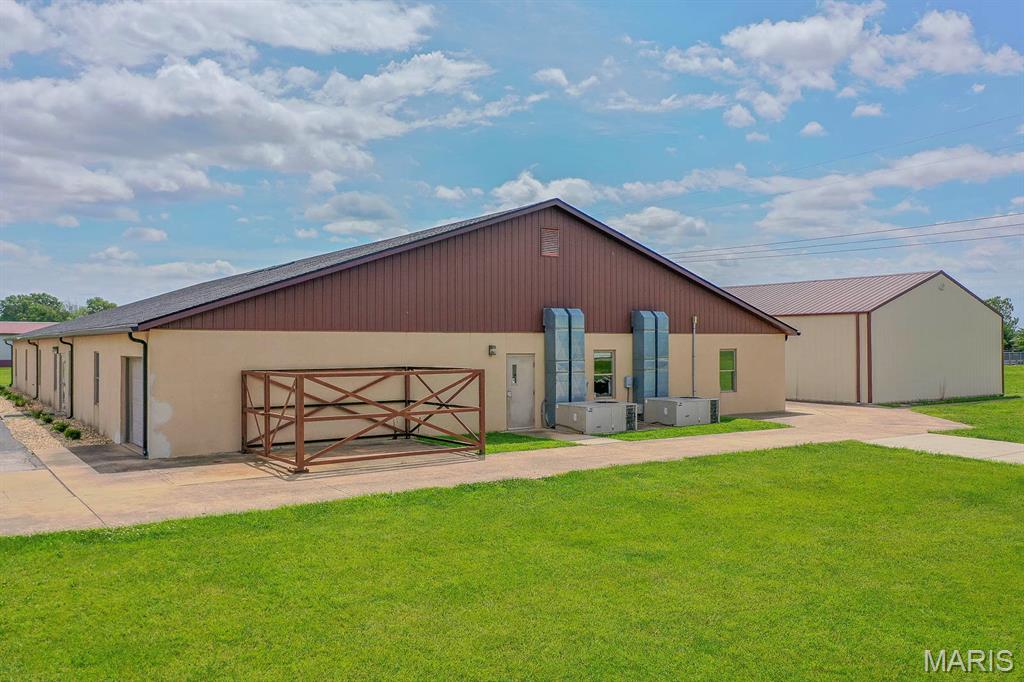 Two, well-maintained light industrial office/warehouse buildings zoned I-2, Industrial and located in the Freeburg Industrial Park. Situated on approximately 0.99± acre, the property includes an 8,400± SF climate-controlled main building with private offices, multiple production rooms, kitchenette, and restrooms. A secondary 2,520± SF clear-span steel building highlighted by a poured concrete floor, has water onsite and is heated and insulated, providing excellent additional storage or shop space. Features include a new roof installed on the main building in November 2025, two drive-in overhead doors, 3-phase electric, compressed air lines, and approximately eighteen on-site parking spaces. Property offers flexibility for owner-user or investor. Convenient access to the St. Louis metro area and regional transportation routes. Whether you are looking to start or expand a commercial operation this property truly checks all the boxes with multi-use potential and convenient accessibility! Square footage listed of 10,920± total SF is combinded suare footage between the two buildings. Property is selling as-is.
