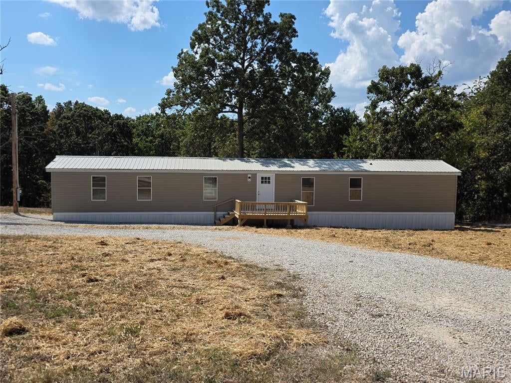 JUST REMODELED 3 Bedroom Home with 2 Full Baths. Very Open Floor plan with LVP Flooring, White Kitchen Cabinets, and Stainless Appliances. Large Primary Suite has double closets and Primary Bath Shows Corner Garden Tub, Double Vanities, and Separate Shower. Two additional bedrooms and another full bath included. Large Utility Room with Additional Cabinets for Storage. TWO New Decks - one on the front of the house and the other on the back. Nice Level Lot with 2.79 acres to enjoy. This is Country Living At It's Best. Central Heat and Air. New Septic System. Located in Laquey School District. Definitely MOVE IN READY!!!!!
