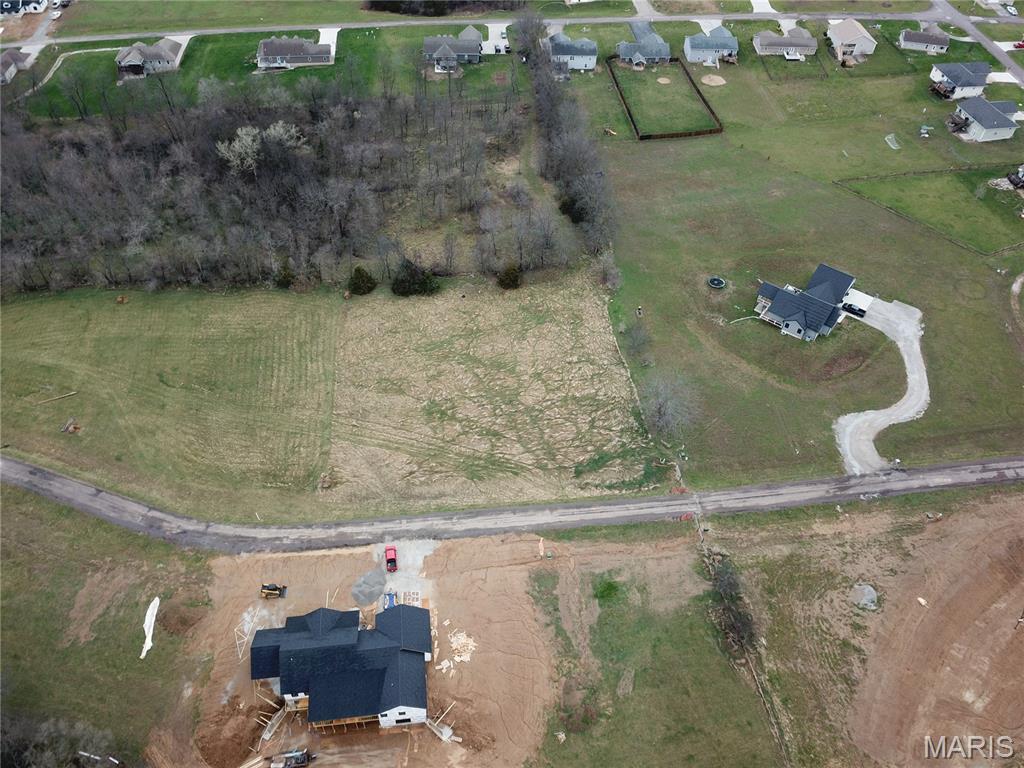 Build your dream home on this 2.684-acre lot located just outside of town in an established & growing subdivision. This property offers the perfect blend of open space and privacy, surrounded by beautiful homes and a peaceful setting. Enjoy the convenience of paved roads and nearby utilities, making your building process even easier. With quick access to town, you’ll have the best of both worlds—country feel with modern convenience. Don’t miss this opportunity—call today for more details!