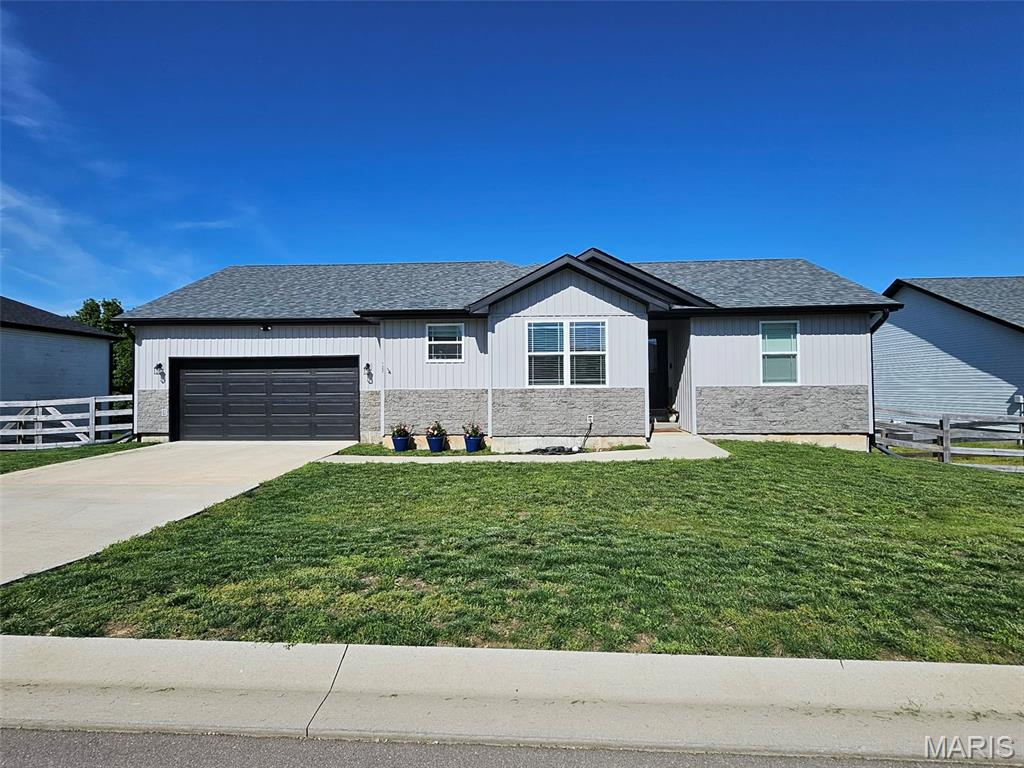 Welcome home to this beautifully designed ranch offering an open floor plan and space exactly where you want it. The large living room impresses with vaulted ceilings, creating a bright and airy feel that flows seamlessly into the spacious dining area and open kitchen. Here, you’ll find stunning granite countertops, a center island, pantry, and sleek black stainless appliances—perfect for both everyday living and entertaining.

Convenience meets comfort with main floor laundry and a thoughtfully designed layout. The primary suite features dual sinks, a walk-in closet, and a walk-in shower, while an additional guest bedroom and full bath complete the main level.

The lower level expands your living space with a generous family room, two additional bedrooms, and another full bath—ideal for guests, hobbies, or just spreading out. You’ll also appreciate the sizable storage room for all the extras.

Step outside to enjoy a covered back porch and patio overlooking a flat, fenced backyard that backs to woods—giving you that peaceful, private feel. An attached two-car garage and built-in storm shelter add practicality and peace of mind.

This one checks all the boxes—space, style, and setting. Don’t blink, or someone else will snag it first.
