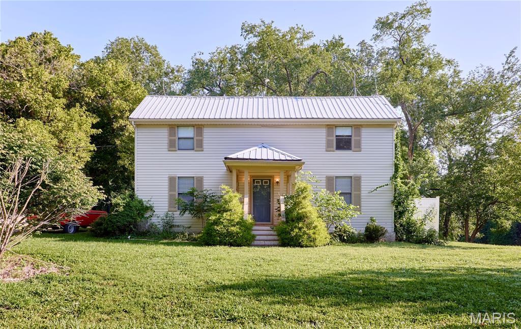 Welcome to this charming two-story home nestled on nearly an acre in the heart of Wildwood. Offering 3 bedrooms, 3 bathrooms, and over 1,600 square feet of living space, this home blends classic character with everyday comfort. The thoughtfully designed floor plan provides inviting living spaces, making it ideal for both relaxing and entertaining. The spacious yard offers endless opportunities to enjoy the outdoors, whether you're gardening, hosting gatherings, or simply taking in the peaceful surroundings. A detached garage adds convenience and additional storage, while the generous lot provides the privacy and space that's becoming increasingly hard to find. Located within the highly acclaimed Rockwood School District, this home combines a quiet country setting with easy access to shopping, dining, parks, and major highways. If you're looking for a property that offers charm, space, and a wonderful location, this Wildwood gem is ready to welcome you home.