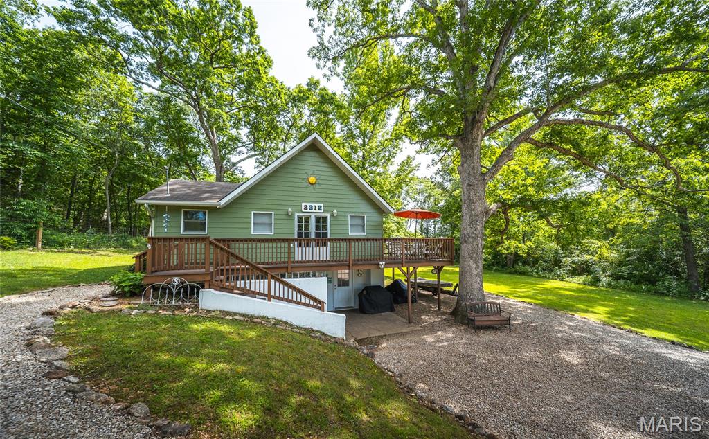 Start enjoying Lake Life! This cozy house sits on 2.5 lots at Indian Lake. Relax on the front deck away from the hustle and bustle of daily life. Within walking distance of cove 9 for easy access to the lake and close to the full service marina/convenience store. The location of this home makes lake life easy! The loft bedroom is perfect for extra guests or storage. Kitchen has a large pantry and plenty of storage and space for cooking at the lake! The living space is expanded by use of the front deck. Lower level offers tons of storage, washer and dryer hook ups (units are negotiable) and a mini garage that is perfect storage for your golf cart! Indian Lake is a 326 (+/-) acre lake that lets you enjoy all the water sports - boating, skiing, tubing, jetskis, fishing and swimming. Enjoy the sandy beach area with playground, pavilion and basketball - or play some tennis or pickleball. The community center hosts a variety of community events all year. Potlucks, poker runs, trivia nights, rummage sales - and many more activities. It can also be rented for private events.