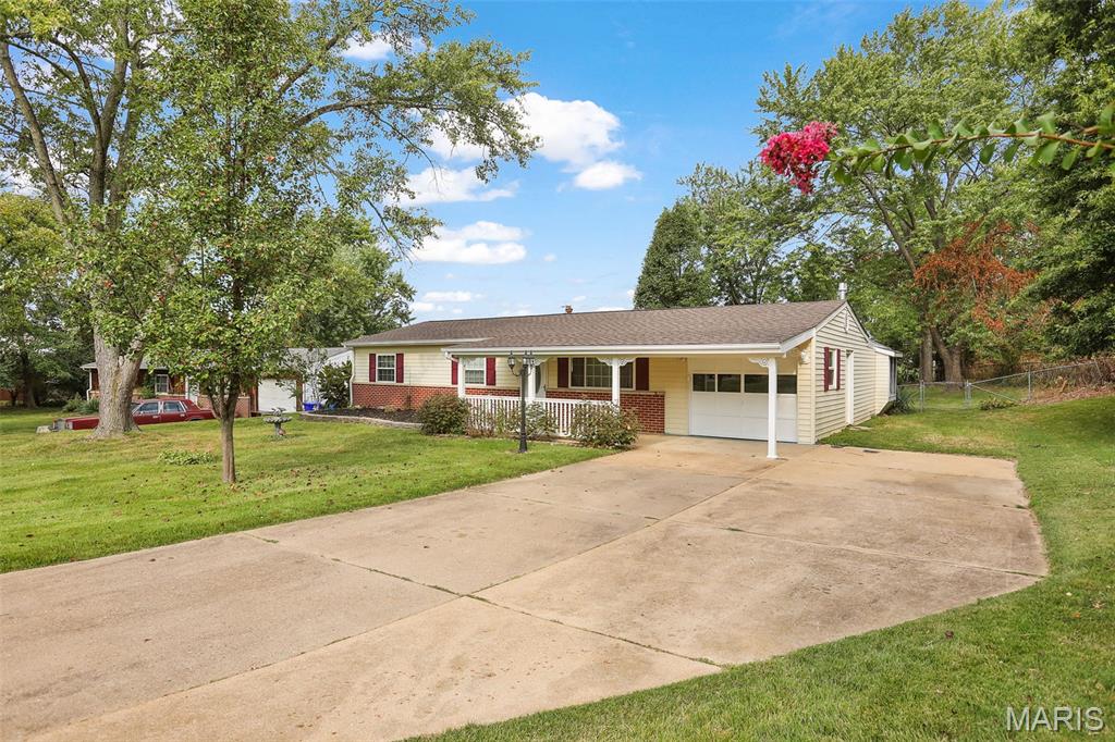 Nicely updated ranch tucked into a cul-de-sac with extra parking for that boat ,camper or extra car, minutes to all Ballwin has to offer right here! This 1500 sq. ft. home has been updated with new bathroom/laundry room, flooring, paint, electric panel, big eat-in kitchen, oversized garage w service door, newer windows, and best of all around back is a large family room w gas stove for those cozy nights and holidays, with a bay window and leads to generous patio overlooking mature trees for privacy in this fenced larger lot. There is an extra closet off kitchen for coats, jackets, boots, keeps the clutter away! Lots of cabinets in good sized kitchen with all appliances to stay. There are 2 good sized sheds for hobbies, extras and more. The front of this home has a covered inviting porch overlooking generous yard, this is a quiet, peaceful, inviting home that has been well loved for many years. Ballwin occupancy is done, this is minutes to Castlewood State Park, I-44, Manchester Rd., all the conveniences here with privacy when you get home, oversized garage with service door, walk right on inside. You will feel right at home here with the fenced cul-de-sac yard, nice plantings , patio, its all ready to go!! Offers will be reviewed Tuesday September 22 at 2 pm, first day of FALL!