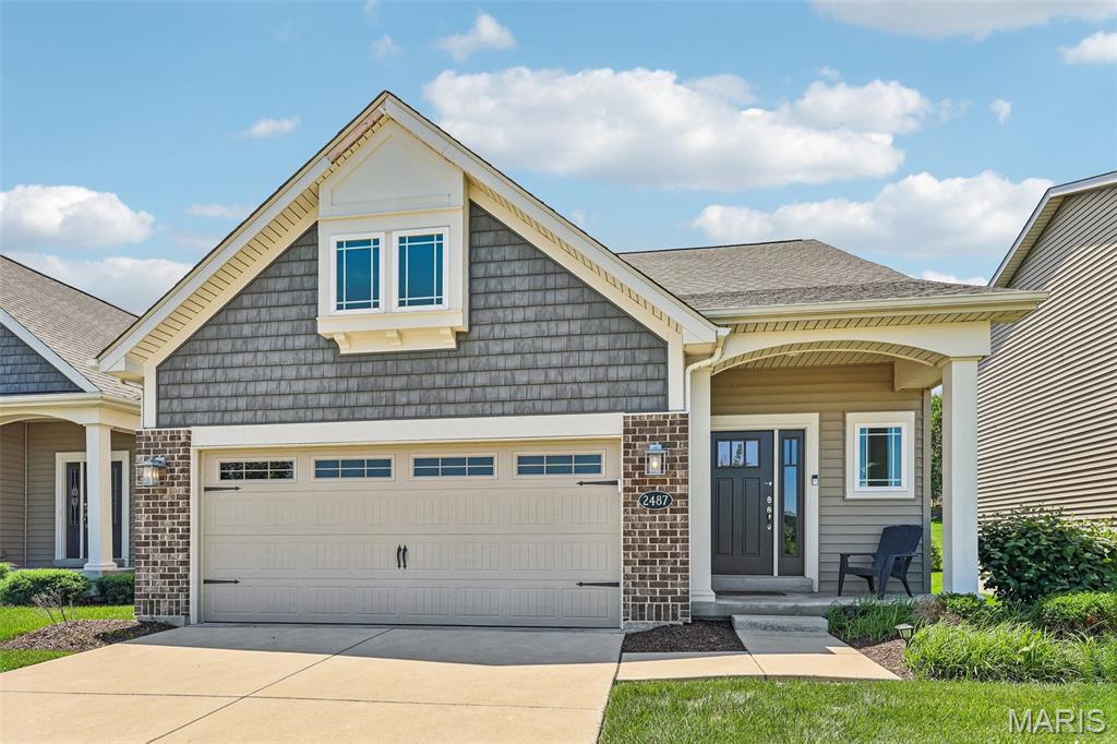 Experience elevated, low-maintenance living in this stunning, move-in ready display home by Fischer & Frichtel, located in the highly desirable Windswept Farms community in Eureka. Set within a 174-acre master-planned neighborhood, residents enjoy resort-style amenities including scenic lakes, a community pavilion, and garden spaces.
This detached 1.5-story villa offers 2,209 sq ft of thoughtfully designed living space with an open, airy layout. Impressive curb appeal features brick and vinyl exterior, architectural shingles, carriage-style garage door, coach lighting, professional landscaping, and irrigation system.
Inside, you’ll find a sought-after main-floor primary suite, 3 bedrooms, and 2.5 baths. The home is loaded with upgrades including 9’ ceilings, engineered wood flooring, wrought iron stair balusters, and abundant natural light from transom windows.
The gourmet kitchen boasts 42” cabinetry with crown molding, soft-close drawers, quartz countertops, tile backsplash, stainless steel appliances, center island with seating, and a wraparound butler’s pantry—perfect for entertaining.
The luxurious primary suite features a spacious shower and double-bowl vanity, while upstairs offers generously sized secondary bedrooms and a versatile bonus room.
Additional highlights include an oversized garage, patio, water softener, zoned HVAC system, Low-E windows, R-50 insulation, and rough-in bath.
Enjoy the perfect blend of comfort, style, and convenience in a vibrant community setting.