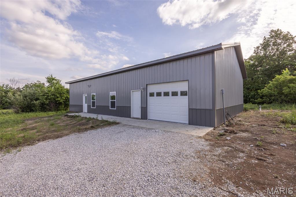 Here is your opportunity to own a unique barndominium-style property located just 3 miles north of Perry, Missouri, and only minutes from Mark Twain Lake. Situated on 3.09 acres of unrestricted ground, this property offers endless possibilities for full-time living, a weekend retreat, or future expansion.

The home features 3 bedrooms, 2 bathrooms, and a very open-concept layout designed for comfortable living and entertaining. The spacious layout offers a functional floor plan with ample space to make the property your own.

The acreage is mostly level with scattered timber, creating a beautiful rural setting while still offering plenty of usable ground. With no restrictions, the new owner has the flexibility to build an additional shop, add improvements, or expand the property to fit their vision.

Whether you are looking for a permanent residence near the lake, a recreational getaway, or an investment with room to grow, this property offers a rare combination of location, versatility, and opportunity.