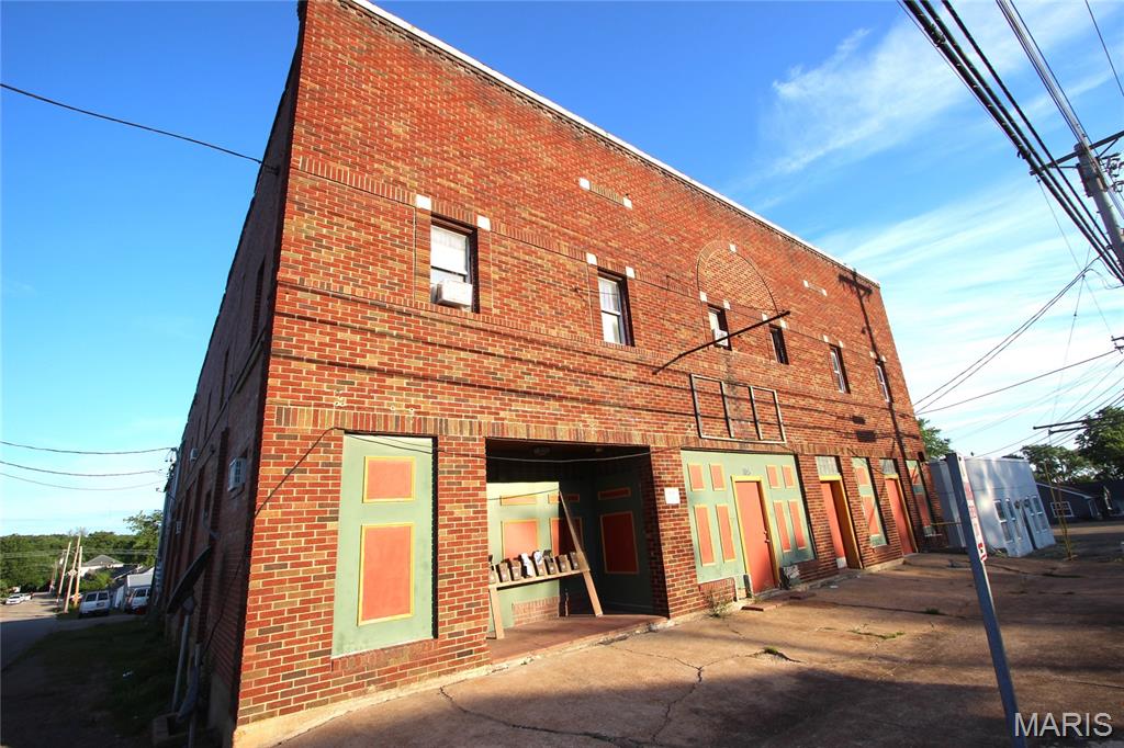 Commercial building with endless opportunity! Offering approximately 7,500 sq ft on each level plus a basement, this property provides incredible space and flexibility. The upper level features 9 one-bedroom apartments and 1 two-bedroom apartment, creating strong income potential. Out back, you’ll find 14 storage units for additional revenue. The main floor and basement are open and ready for your vision—ideal for retail, office, or mixed-use development. Don’t miss this unique investment opportunity—schedule your showing today!