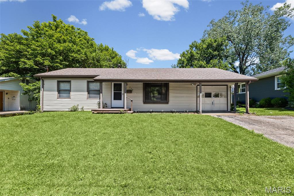 Tucked away on a quiet dead-end street in Collinsville, this beautifully maintained 2-bedroom, 1-bath home offers the perfect combination of comfort, updates, and outdoor space. From the moment you step inside, you'll appreciate the bright and spacious living room filled with natural light that creates a warm and inviting atmosphere. The renovated kitchen serves as the heart of the home, featuring modern updates and a functional layout that's perfect for everyday living. Both bedrooms offer comfortable living spaces, while the home's move-in ready condition allows you to settle in and start enjoying it from day one. Outside, you'll find one of the property's standout features, an extremely large, fully fenced backyard with plenty of room for pets, play, gardening, entertaining, or simply relaxing in your own private outdoor retreat. The back patio provides the perfect spot for morning coffee, summer cookouts, or evening gatherings with friends and family. An attached garage adds convenience, while the large unfinished basement offers endless possibilities for additional storage, a workshop, home gym, or future finished living space to fit your needs. Located just minutes from Main Street, shopping, dining, parks, and everyday amenities, this home combines a peaceful setting with easy access to everything Collinsville has to offer. You will not want to miss this one, schedule your showing today!