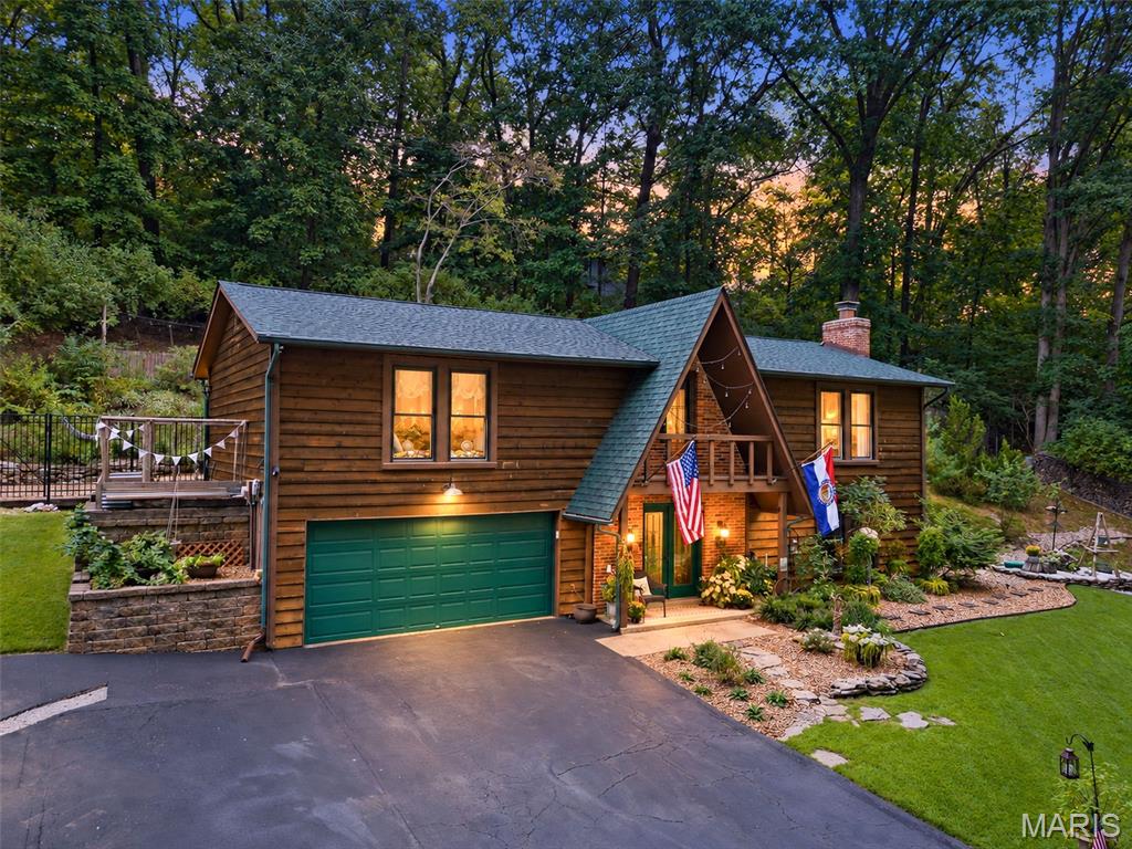 Welcome to 7 Briarpath, where warmth, character, and a beautiful wooded setting come together to create a home that feels like a retreat. Surrounded by mature trees and thoughtfully landscaped outdoor spaces, this home offers plenty of room to relax, entertain, garden, and enjoy the outdoors. Inside, you’ll find inviting living spaces filled with personality, including a spacious living room anchored by a classic brick wood-burning fireplace—perfect for cozy evenings at home. The chimney has been cleaned regularly for continued care and maintenance. The kitchen opens to the dining area with breakfast bar seating, creating an easy flow for everyday living and entertaining. Large windows throughout bring in natural light while showcasing the surrounding greenery.

Step outside and the setting really shines. Multiple outdoor areas provide space for dining, relaxing, or enjoying a quiet evening surrounded by nature. Path lighting adds ambiance throughout the backyard, while established landscaping and raised garden beds are ready for the next owner to enjoy. The mature trees create a private, tucked-away feel that’s hard to replicate. An attached garage adds everyday convenience and features a newer garage door opener with battery backup. From the distinctive exterior and wooded surroundings to the cozy fireplace and outdoor spaces, 7 Briarpath offers a unique combination of character, comfort, and nature—ready to welcome its next owner home.