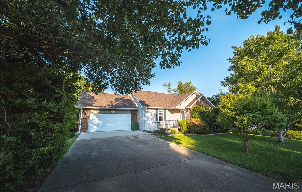 JUST LISTED! Welcome home to this spacious 4-bedroom, 2.5-bath ranch offering comfort, updates, and plenty of room to spread out! This home features new carpet, a freshly remodeled basement, updated kitchen, beautiful hardwood floors, vaulted ceilings, main-level laundry, and a convenient split-bedroom floor plan. Enjoy the added space of a full walkout basement, office or possible 5th bedroom, updated composite deck, fenced backyard with patio, and a new roof and gutters installed in March 2026. Located close to the Acorn walking trail and town amenities, this home offers so much to love at an affordable price! Call today to schedule your private showing!