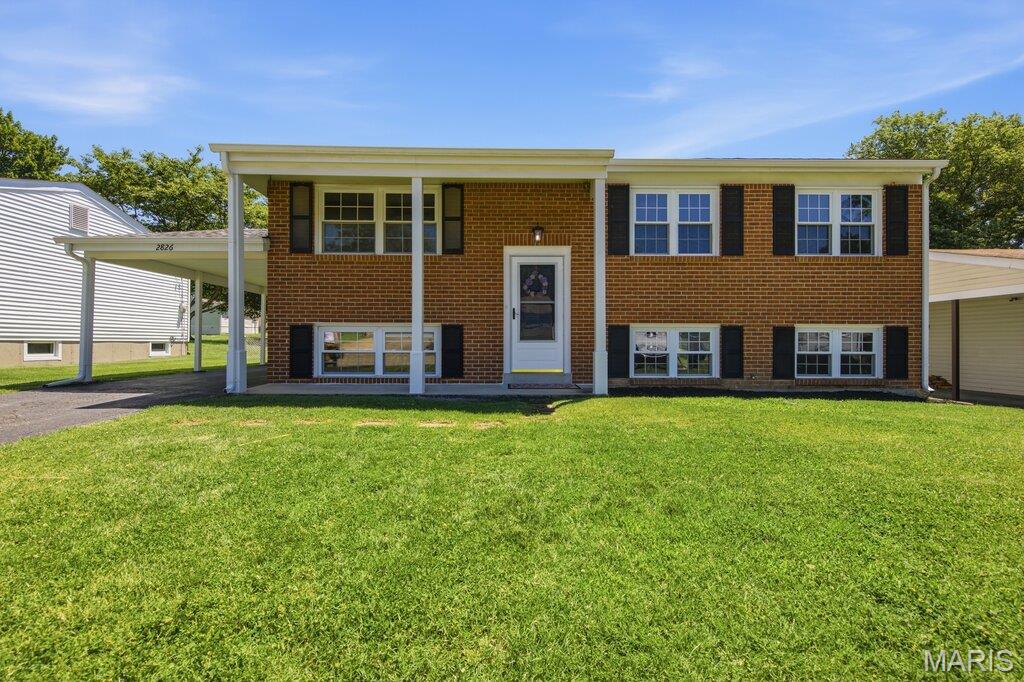 Welcome home to 2826 Cherry Point Lane, a beautifully updated 3-bedroom, 2-bath split-level in the heart of Maryland Heights! From the moment you walk through the door, you'll appreciate the fresh, bright feel created by newly refinished hardwood floors, fresh paint, and thoughtful updates throughout.  The kitchen is ready for everything from busy weekday mornings to weekend gatherings, featuring updated cabinet doors & hardware, a new peninsula with seating, and brand-new stainless steel appliances including an electric range, microwave, and dishwasher. Updated lighting, new interior doors, and refreshed finishes give the home a clean, modern look while maintaining its welcoming charm.  Downstairs, the finished lower level offers even more room to spread out. With new luxury vinyl plank flooring, a refreshed full bath, and walk-up access to the backyard, this versatile space can easily become a family room, game room, home office, workout area, or guest retreat.  Step outside and you'll find a backyard built for enjoying Missouri's beautiful seasons. The brand-new wood deck overlooks a flat, fenced yard that's perfect for kids, pets, backyard barbecues, gardening, or simply relaxing with your morning coffee. A freshly painted storage shed adds extra convenience, while new window screens throughout the home and a professionally cleaned and sealed driveway mean many of the details have already been taken care of for you.  Need storage? You'll love the extra-deep attached carport and more than 450 square feet of additional storage, workshop, or hobby space, giving you plenty of room for tools, projects, and all the extras that come with everyday life.  The location is just as appealing as the home itself. Conveniently situated near Dorsett Road, Westport Plaza, Creve Coeur Park, shopping, dining, entertainment, and major highways, you'll enjoy easy access to everything you need while still feeling right at home in the neighborhood.  Move-in ready and packed with updates, this Maryland Heights gem won't last long!!  OPEN HOUSE SUNDAY, JUNE 21ST FROM 1P-3. Don’t Sleep on Your Dream Home, Sleep in It!