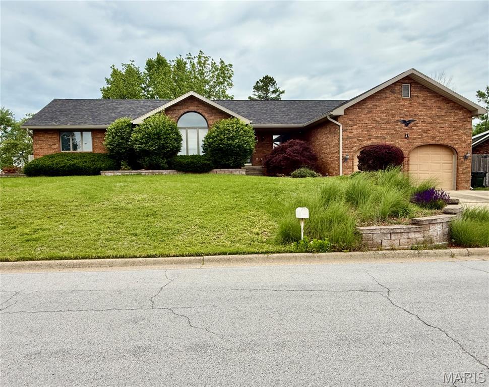 Welcome to 1503 Sherman Avenue in Rolla, Missouri. This ranch-style home offers approximately 2,280 square feet of living space on a 0.32-acre city lot in the Heritage Heights subdivision.

The main level features three bedrooms, two full bathrooms, and multiple living and gathering spaces, including a family room with a fireplace. The kitchen is equipped with an electric cooktop, oven, microwave, dishwasher, refrigerator, and additional appliances that convey with the property. Flooring includes a combination of carpet and ceramic tile throughout the home.

Additional interior features include a main-level laundry area, central air conditioning, forced-air heating, and ceiling fans. The partially finished basement provides additional flexible space with a recreation room and extra storage potential.

Exterior improvements include brick veneer and vinyl siding construction, an attached two-car garage, rain gutters, and a private yard. The property is connected to public water and public sewer services and is located within the Rolla city limits.

Conveniently situated near local amenities, this property offers comfortable single-level living with additional space for a variety of needs. All measurements are approximate and should be independently verified by the buyer.