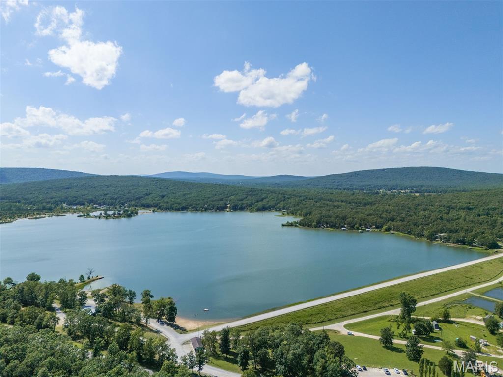 Enjoy lake living in the private gated Lake Hanna community! This property includes a camper with an attached deck, solar panels, power bank, and camper water system, making it ready for immediate enjoyment. Residents enjoy access to boating, fishing, swimming, community beaches, and year-round recreation in one of the area's most desirable lake communities. Property is being sold as is, buyer and buyer's agent to do their own due dilignece.