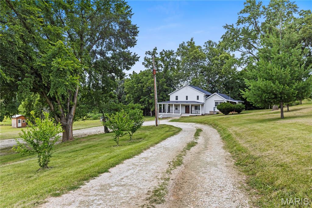 Welcome to 2257 S Highway W! Situated on nearly 9 acres with no restrictions, this unique property offers endless possibilities for those looking for space, freedom, and country living. The home features 6 bedrooms, providing plenty of room for a growing family, multi-generational living, guests, or a home office setup. Multiple outbuildings offer abundant space for equipment, livestock, storage, workshops, or recreational use, and the property is horse-friendly with plenty of room to ride and roam.

Enjoy summer days by the pool while taking in the peaceful surroundings and privacy this acreage provides. The property offers a fantastic opportunity for the next owner to add their own finishing touches and make it truly their own. Whether you're dreaming of a hobby farm, homestead, or simply a place with room to spread out, this property is full of potential and ready for its next chapter.