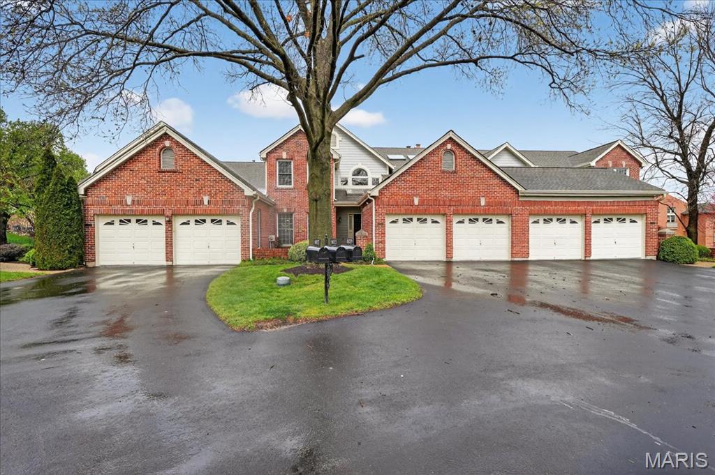 Beautifully designed 1.5-story villa offering an ideal blend of space, comfort, and timeless style. Step inside to a dramatic two-story great room featuring a wood-burning fireplace, custom built-in bookcases with cabinetry, and direct access to the deck, all seamlessly flowing into the formal dining room—both accented by rich wood flooring. A private study with wood floors, leaded glass double doors, and built-in bookcases creates the perfect work-from-home retreat. The kitchen is well-appointed with tile flooring, solid surface countertops, center island, planning desk, tile backsplash, an electric cooktop, and opens to a bright breakfast room. The main-level primary suite offers a spacious bedroom with both a walk-in closet and an additional closet, private deck access, and an ensuite bath with double vanities, soaking tub, and separate walk-in shower. Upstairs, you’ll find a versatile loft with a built-in desk, along with two additional bedrooms and a full Jack & Jill bath. The walk-out lower level expands your living space with a large rec room featuring a second wood-burning fireplace, built-in bookcases, and a walk-behind wet bar, plus an exercise/hobby room, bonus room, and full bath. Additional highlights include a main floor laundry room, deck, aggregate patio, two-car garage, and so much more. A wonderful opportunity for low-maintenance living without compromising on space or style.