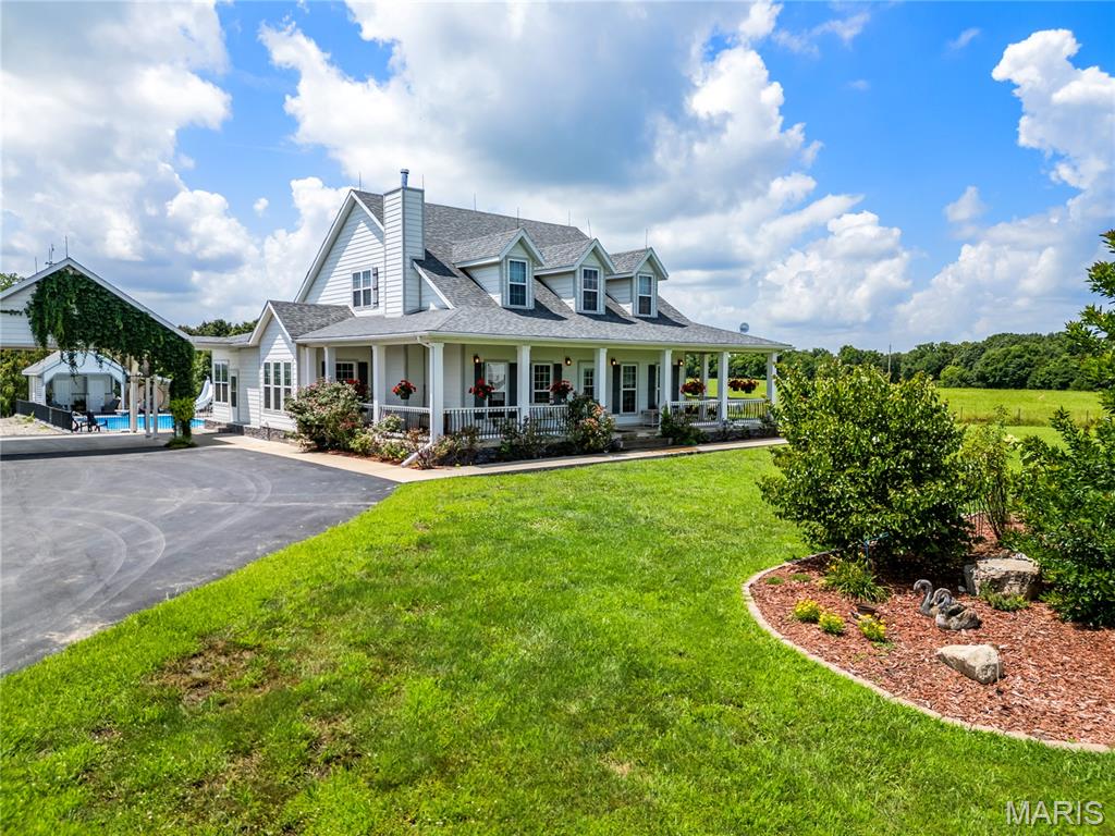 Discover the perfect blend of luxury, space, and rural charm on 67.37 acres, truly a hunter's paradise and private retreat. This exceptional property features a stunning modern farmhouse built in 2018, offering 4 spacious bedrooms and 4 full bathrooms designed for refined country living. A wide wrap-around porch invites you to relax and take in sweeping views of the surrounding landscape. Inside, the home showcases comfort and functionality with two primary suites, high-end finishes, a commercial-grade kitchen with an oversized pantry ideal for entertaining, and a beautiful library with custom built-in shelving. Step outside to your own private oasis with an in-ground saltwater pool, complete with a poolside shower, bathroom, and additional storage, perfect for summer enjoyment. The property also includes a large climate-controlled shop with a vehicle lift, ideal for hobbies, storage, or business use. A second home offers 3 bedrooms, 2 bathrooms, and an unfinished basement, providing excellent guest or rental potential. Two fenced fields are ready for livestock, adding to the property's versatility. Whether you're seeking a private family estate, recreational getaway, or investment opportunity, this one-of-a-kind property truly delivers. Pre-approval or proof of funds required for all showings.