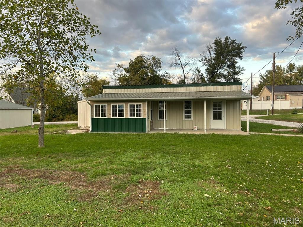 Don't miss a great opportunity for a single-family home or that weekend retreat. "Shouse" build. NEW ROOF Sept. 2025. Nice level lot sitting on the backside of town. Conveniently located in Perry, minutes from the lake, shops and restaurants.  Additional shop on property great for boat storage or working on projects with electric and concrete floor. All appliances included with sale.