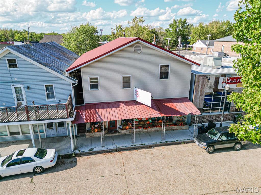 JUST LISTED 
Incredible investment opportunity in the heart of Downtown St. James! This versatile, mixed-use property features over 1,500 sq ft of commercial/retail space on the main level, currently home to a successful florist shop, and perfect for launching your own business or expanding your investment portfolio. 
Upstairs, you'll find two well-maintained 1BR/1BA apartments, occupied with long-term tenants, but could also make great Airbnbs. With prime downtown visibility, excellent walkability, and all the small-town charm, this property is packed with potential! Don’t miss out, properties like this rarely hit the market!