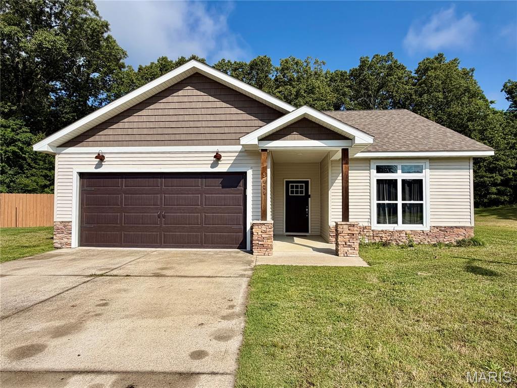 Beautiful 3-bedroom, 2-bath home located at 5919 Melissa Lane in Poplar Bluff, MO! This home boasts a spacious floor plan, beautiful curb appeal, and a bright kitchen and living room with large west-facing windows overlooking the backyard that fill the space with warm natural light. The kitchen offers stainless steel appliances and an eat-at counter-height island, perfect for everyday living and entertaining. The large primary suite features double vanity sinks with tower cabinet storage and a walk-in closet. Enjoy plenty of storage with the attached two-car garage and relax outdoors on the concrete back patio. Conveniently located in the country while still being close to all the amenities of town.