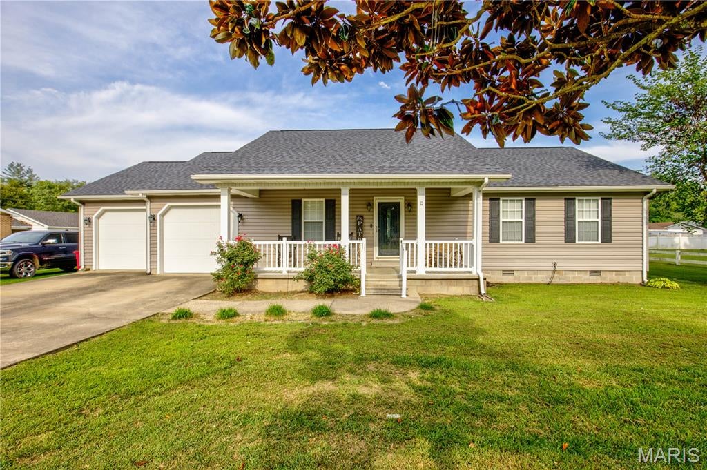 Call me today to tour this amazing home!  This 3 bedroom 2 bath home is ready for its next owners!  You will immediately feel at home with the beautiful wood floors and vaulted ceilings!  The most adorable kitchen from the details in the ceiling to the huge island, it is definitely a kitchen to cook and entertain in!  The wide hallway contains 3 bedrooms and 2 bathrooms.  All bedrooms are large with big closets!   You will not only have a beautiful from porch to sit on but a great deck out back to enjoy the yard!  The 2 car attached garage is large and great for storage!