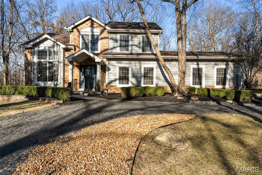 Ultimate privacy in a wood sanctuary, minutes from top schools, shopping, highways and restaurants in prestigious Creve Coeur. This Exceptional renovation blends luxury and modern convenience, located at the end of the cul-de-sac on a private wooded acre backing to Millenium Park.  Enter through a dramatic marble foyer to enjoy the sophisticated spaces of this 1.5 story home. The Living Room is a focal point with soaring ceiling, wide-plank flooring and a see-through fireplace.  The kitchen is a chef’s dream with premium appliances and custom finishes, butler’s pantry and easy access to the formal dining room.  The breakfast room is currently being used as a family room to enjoy the woodburning fireplace and views of the lush landscape.  The 1st floor primary suite has access to one of two decks, walk-in closet and a spa-like bath.  A beautiful four-season room features floor to ceiling windows to enjoy your private oasis.  Need work space? A beautiful study is just off the foyer. First floor laundry has custom cabinetry and a dog washing station. The 2nd floor features 3 bedrooms, and updated bath. A finished LL with luxury vinyl flooring, updated full bath, sleeping area and kitchenette provides additional quality living space. Energy-efficient upgrades include High-efficiency Lennox HVAC, 80-gallon tankless HWH, and Level 2 EV charger for comfort and savings.  An oversized 2 car garage completes this stunning home. Your buyers won’t want to miss the one. See the attached listing for additional updates.